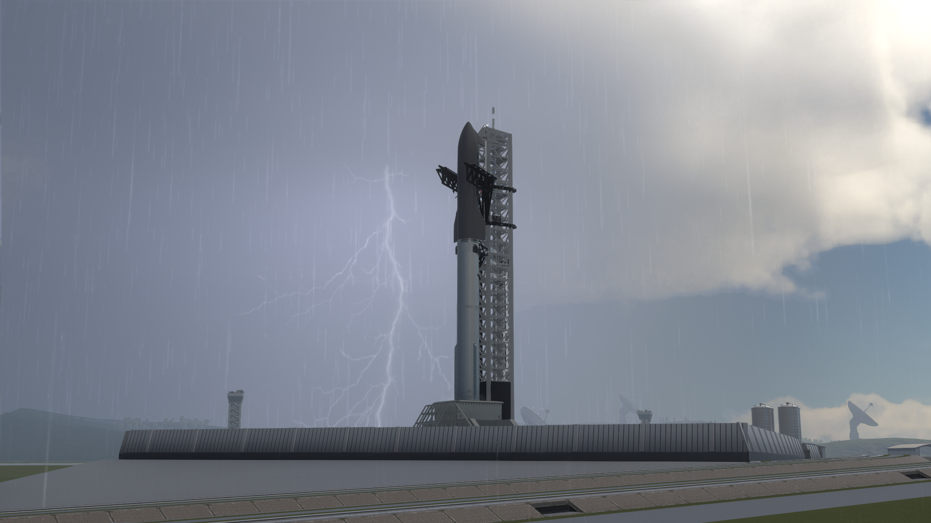 Rhea standing on its launch mount in heavy rain with lightning flashing behind the pad.