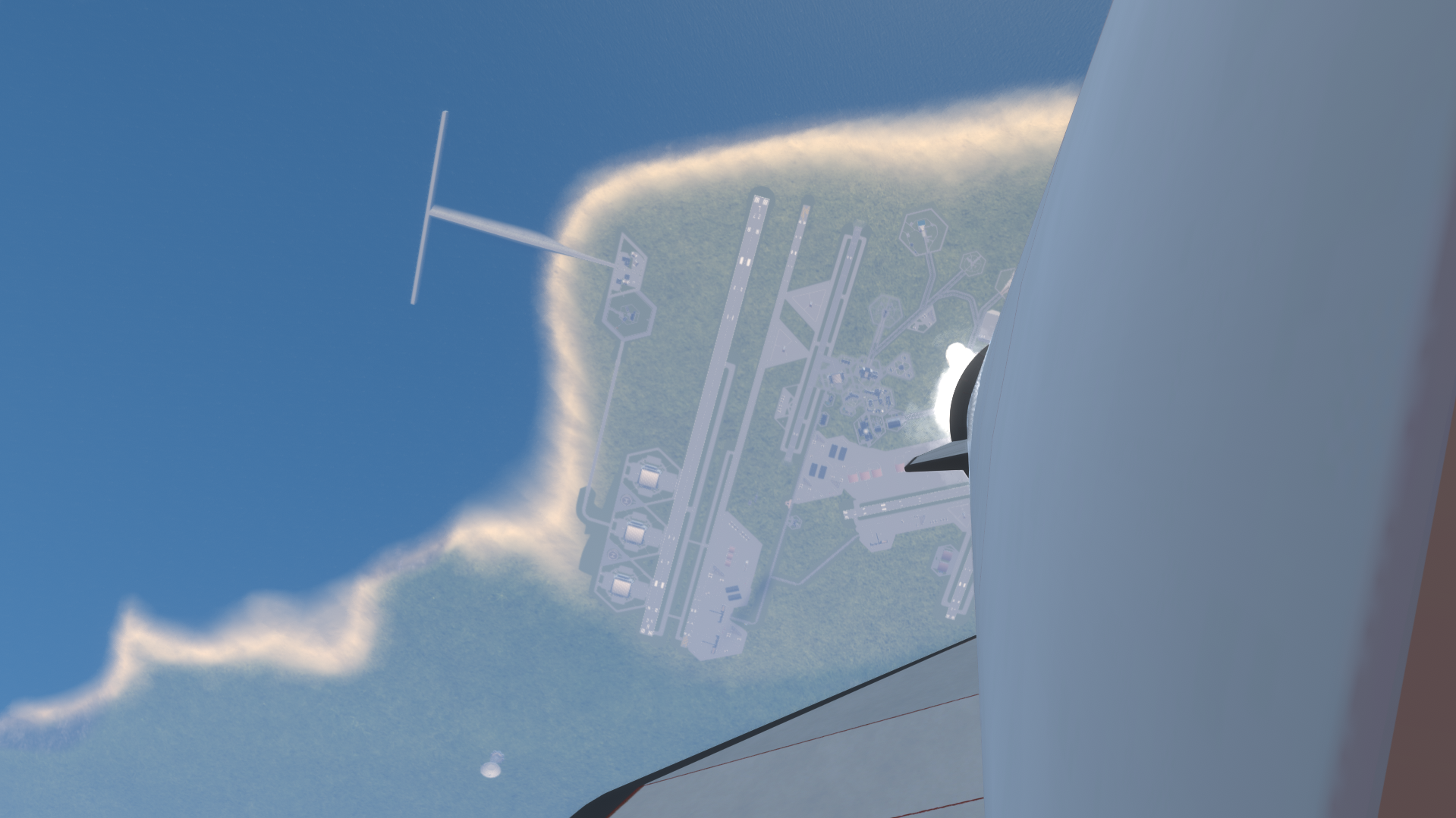 View from Daphnis in flight above the coastline and launch complex.
